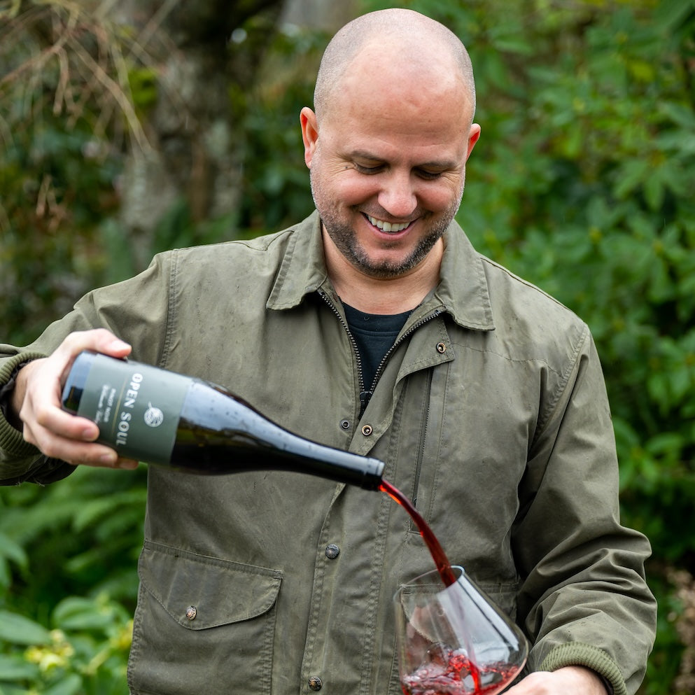 Cropped square image of Jordan pouring wine